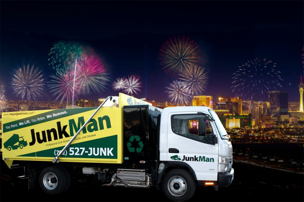 JunkMan truck in front of city fireworks display.